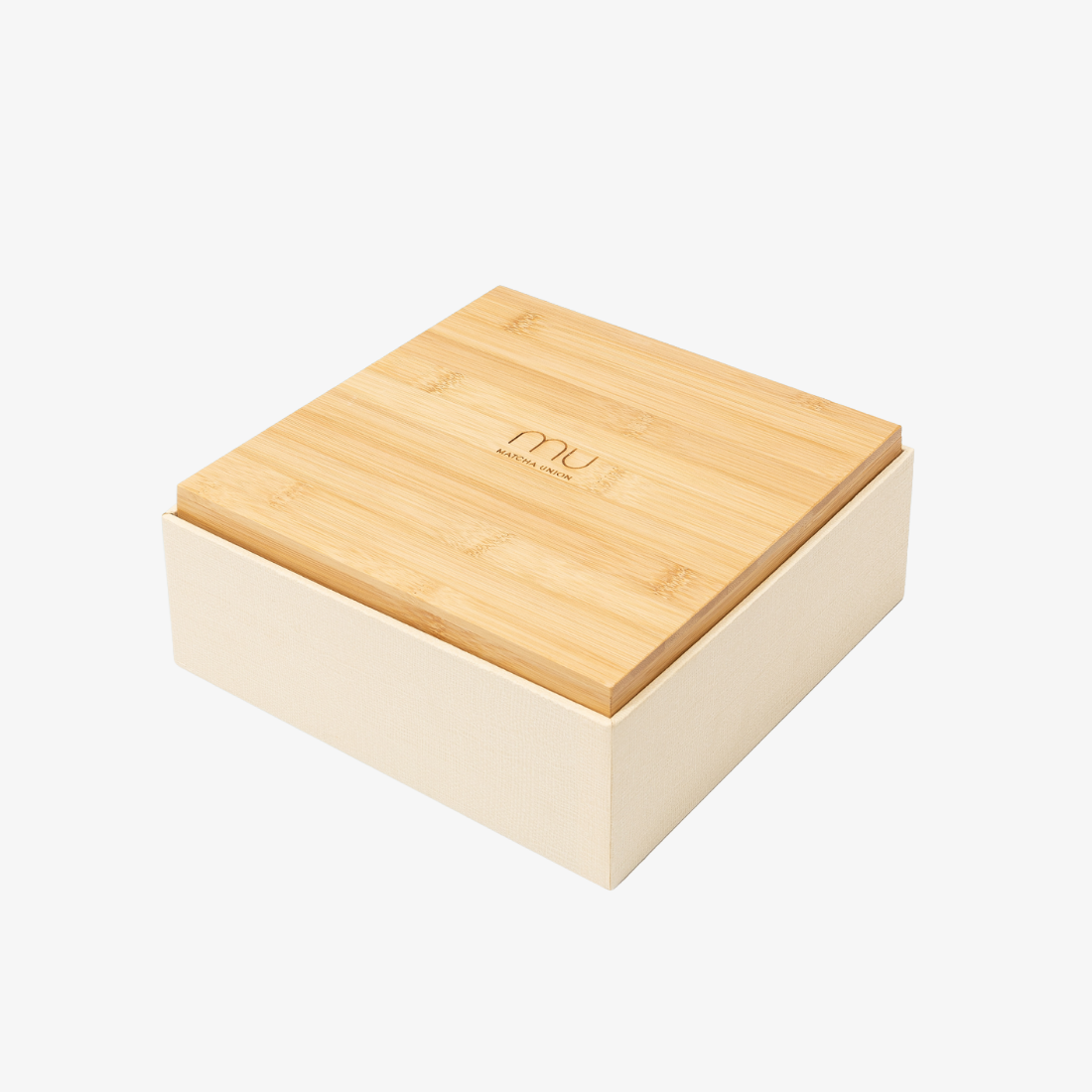 Closed Matcha Union Ceremony Set presentation box with a logo-engraved bamboo lid that doubles as a tray for matcha preparation.