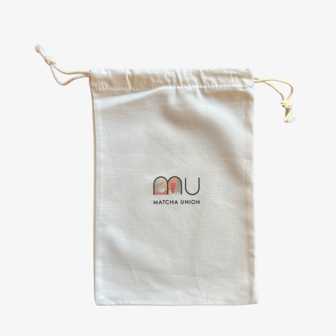 Cream cotton drawstring gift bag with the Matcha Union logo, for wrapping matcha gifts or keeping matcha tools together.